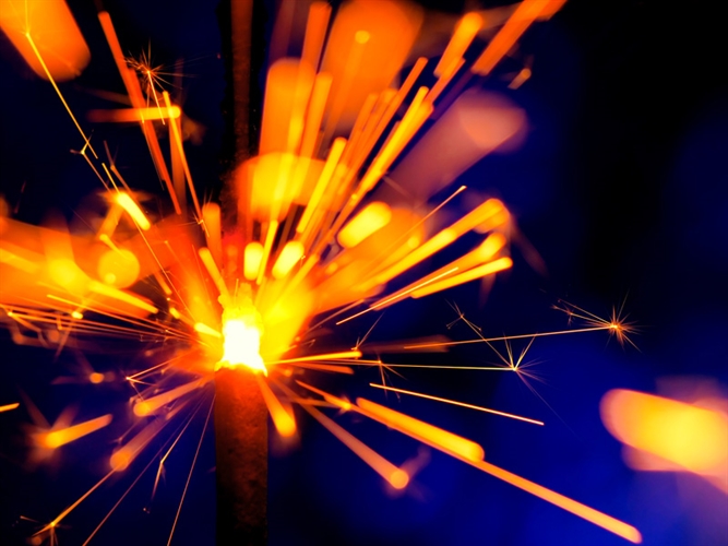 Close up of a lit sparkler on bonfire night